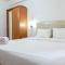 Compact Studio Signature Park Grande Apartment MT. Haryono By Travelio