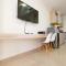 Comfy Studio Room with City View at Menteng Park Apartment By Travelio