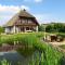 Land FeWo am Teich_ Reet gedeckt_O Foto: Land FeWo am Teich_ Reet gedeckt_O