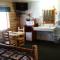 Wolf Den Log Cabin Motel and RV Park