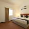 Foto: Capital O 224 Holiday Beach Resort 3/35