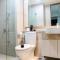 Sea View 1BR at Gold Coast Apartment near PIK By Travelio