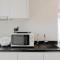 Comfy and Elegant 1BR Branz BSD Apartment By Travelio - Tangerang