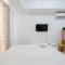 Minimalist Studio at Azalea Suites Cikarang Apartment By Travelio