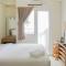 Cozy Studio Green Pramuka Apartment next to Mall By Travelio