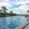 Minimalist and Posh 1BR The Oasis Cikarang Apartment By Travelio