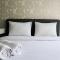 Minimalist 1BR Apartment at M-Town Signature By Travelio