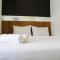 Warm and Cozy 3BR Apartment at M-Town Residence By Travelio