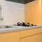 Minimalist and Homey 1BR Grand Kamala Lagoon Apartment By Travelio