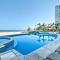 Beachfront Resort Condo with Wraparound Balcony!