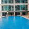 Cozy Living 1BR at Brooklyn Alam Sutera Apartment By Travelio