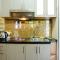 Furnished Studio with Comfortable Design Green Pramuka Apartment By Travelio