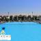 Marsilia Beach 3 Chalet with private garden - pool view مارسيليا بيتش 3 شاليه للعائلات أرضى غرفتين - ‘Izbat Ḩalāwah