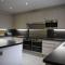 Toothbrush Rooms at Lattice Lodge - Guest Kitchen & EV Recharging