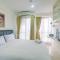 Modern Studio at Tifolia Apartment By Travelio