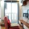 Cozy and Modern Studio Apartment at Belmont Residence Puri By Travelio