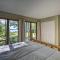 Interlochen Home on Green Lake with Dock and Beach!