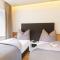 Riedz Apartments Innsbruck- Zentrales Apartmenthaus mit grüner Oase