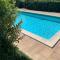 Apartment Charme and Relax with Garden and Swimming Pool