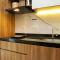 Comfortable Design 1BR Apartment Ciputra International By Travelio
