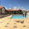 Linda casa Porto das Dunas: 4 suítes, churrasqueira e piscina