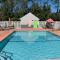 Magnolia Inn Extended Stay of Kingsland - New 2024 - Book a Kitchen Room - 12 Noon Check Out - Sleep In Late - Better Sleep - Ultra Sparkling - Pool open until until 4AM - Stay and Save Today - 24 Hour Front Desk - Premium Coffee Bar - Award Winning Inn