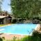 Quiet rustic farmhouse, surrounded by greenery, swimming pool with tennis court
