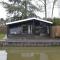 Modern chalet in a small park with a fishing pond - Geel