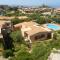 2 bedrooms house with sea view shared pool and furnished garden at Costa Paradiso 2 km away from the beach