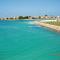 Charming house near Markaz Al Alamein with shared pool. - العلمين