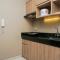 Cozy and Wonderful 1BR Ciputra International Apartment By Travelio