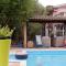 Big relax apartment with swimming pool and a peaceful garden in a private villa