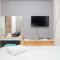 Cozy Stay 1BR at Grand Kamala Lagoon Apartment By Travelio