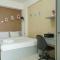 Comfort and Strategic Studio Apartment Margonda Residence 2 near UI By Travelio