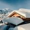Heidi Chalets Falkertsee - Luxuschalet Bergwinter