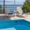 Villa Andonis Nissaki large villa with large pool ,spectacular view very near to the Beach