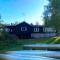 Vålkojan Naturby - Timber cottages with river view