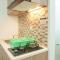 Lovely and Strategic Studio at Green Pramuka Apartment By Travelio