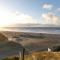 Beautiful house at beach, sea and dunes
