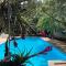 Big relax apartment with swimming pool and a peaceful garden in a private villa