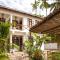 KIMA Serviced Beach House & Suites