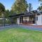 Relax in the spa with views opposite Lake Eildon