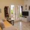 Beachfront apartment with big terrace and garden