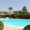 Casa Vacanze Libeccio - Villetta con giardino e piscina condominiale