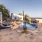 Casa Algarrobo by Rosas Cantares