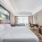 Vienna International Hotel Xinyang Yangshan New District - Xinyang