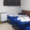 Pousada Quarto com frigobar,ar e garagem gratuita