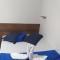 Pousada Quarto com frigobar,ar e garagem gratuita