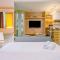 Modern and Spacious Studio with City View @ Grand Kamala Lagoon Apartment By Travelio