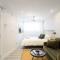 Serene and Styled Little Italy Studio full bath by Den Stays - Montréal